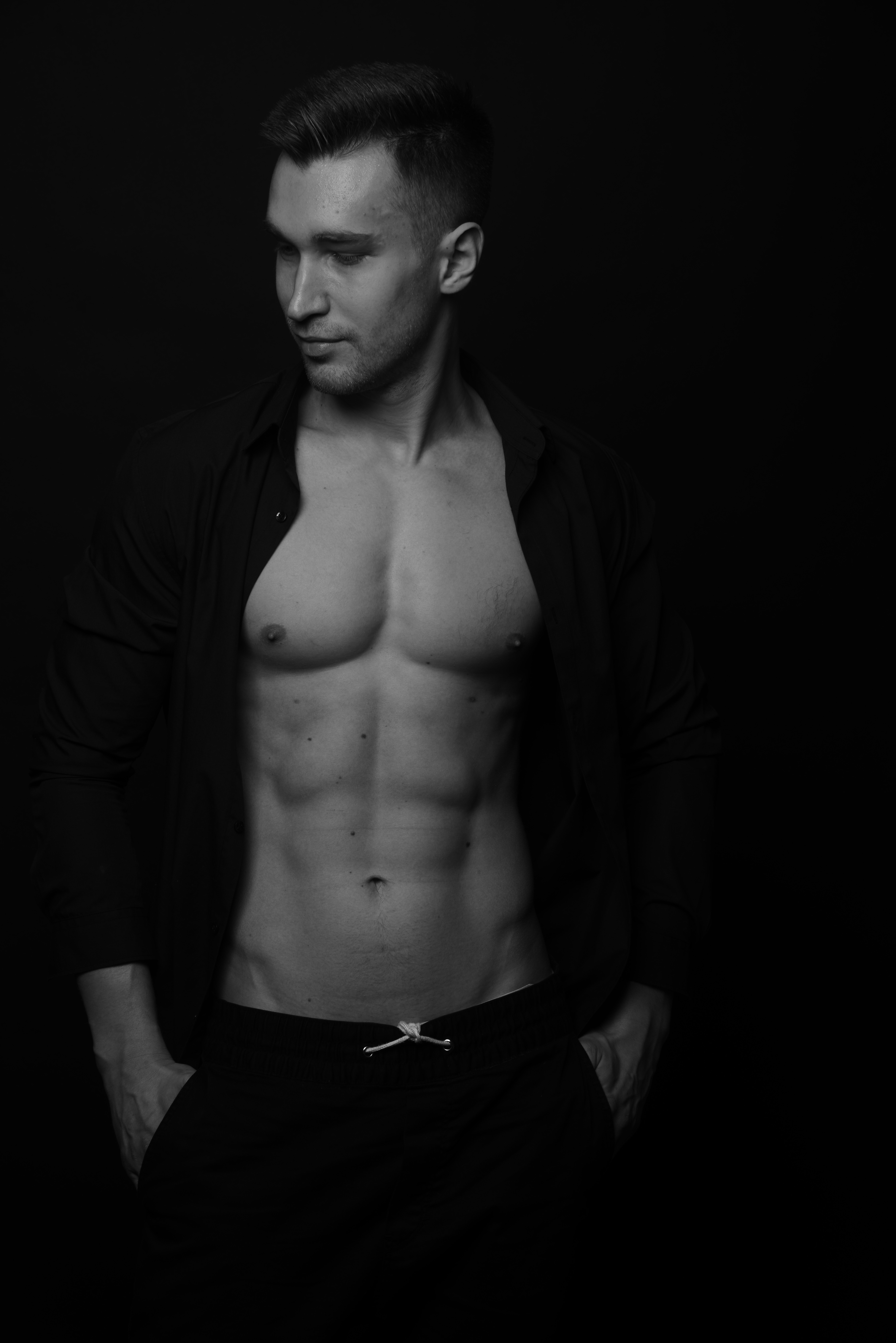 Dmitriy Kovin photographed in low key black and white